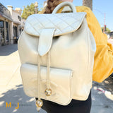 Vintage Chanel Double C Cream Lambskin Drawstring Flap Backpack